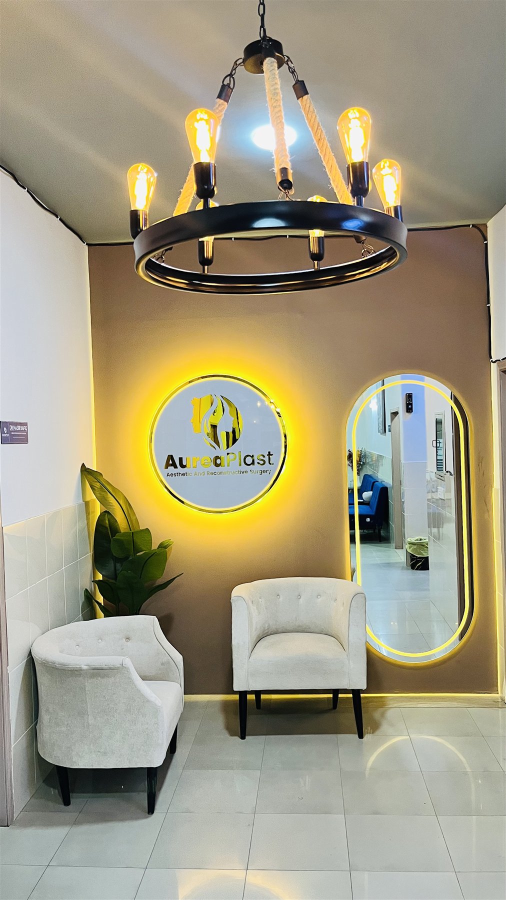 Aurea Plast reception lounge with illuminated logo
