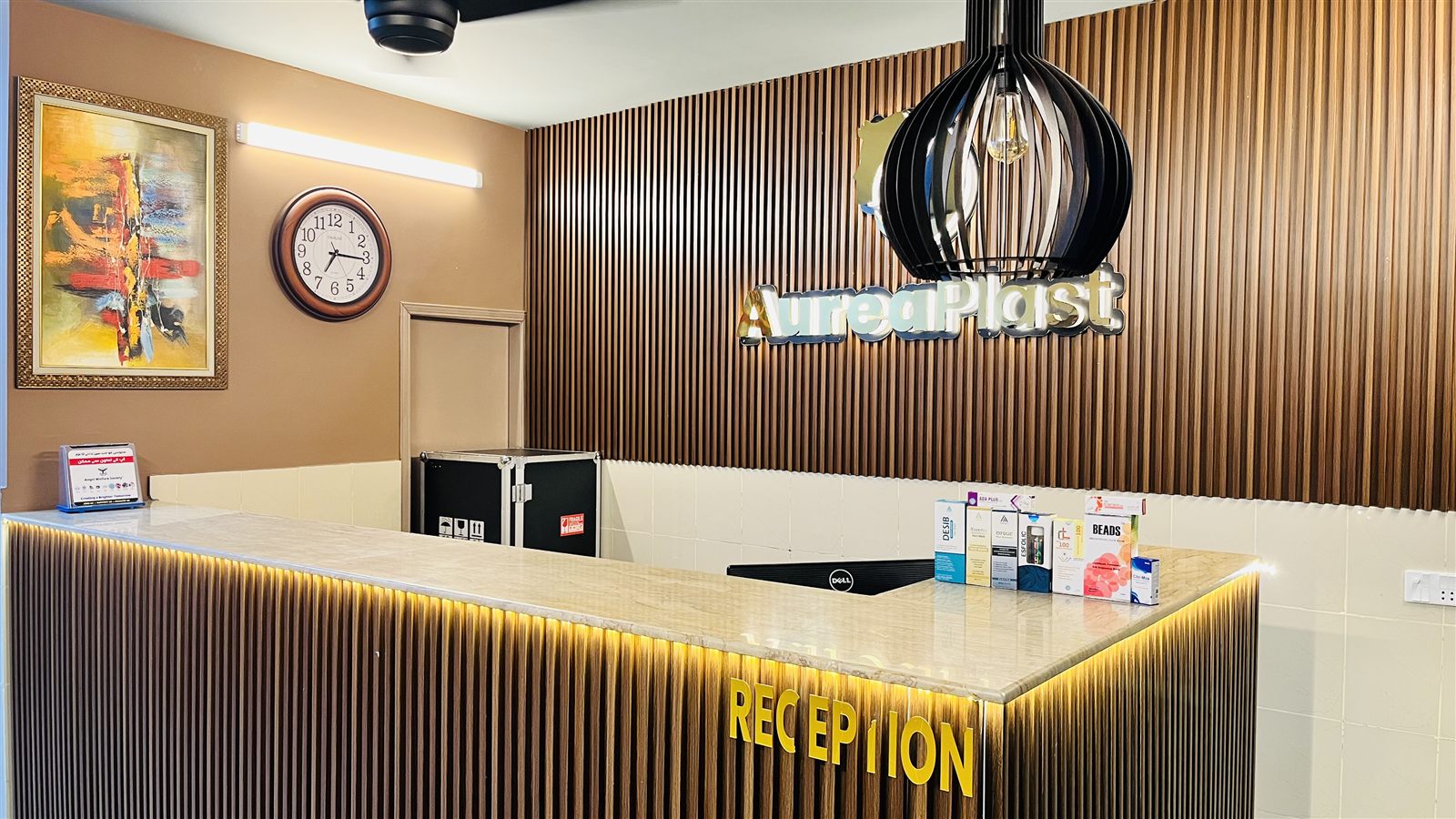 Aurea Plast front desk and wood feature wall